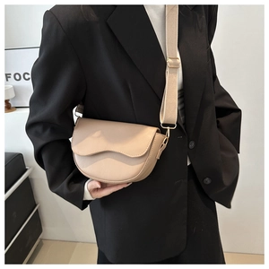 Chic beige half-moon saddle bag for women with wide adjustable fabric shoulder strap