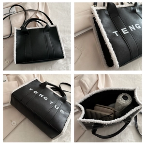 Detail showing plush trim on black leather tote with internal capacity for daily items