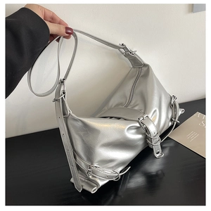 Y2K metallic silver shoulder bag with buckle straps and textured faux leather finish
