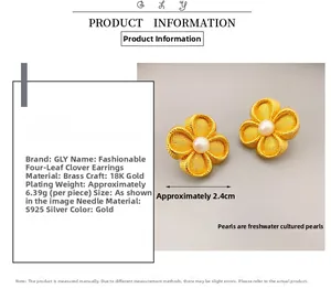 Detailed view of 18K gold plated clover earring featuring a lustrous freshwater pearl center