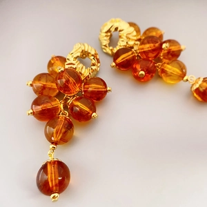 Retro amber bead drop earrings with grape cluster design and gold textured metal studs