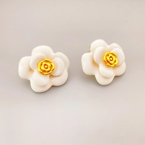 Elegant white camellia flower earrings with gold rose center in minimalist French style