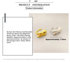 Detailed view of wing-shaped 18K gold plated brass ear cuffs with zircon accents