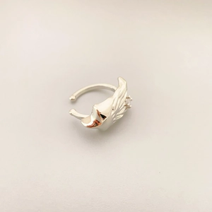 Silver-toned wing shaped ear cuff plated in 18K gold with a small zircon stone