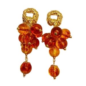 Elegant gold earrings featuring a vintage grape cluster design with amber resin beads