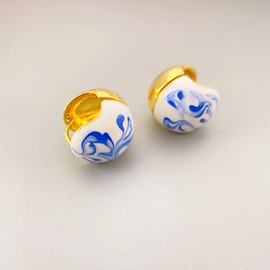 Elegant gold-plated hoop earrings with blue and white enamel porcelain spherical pendants