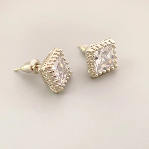 Square cut zircon stud earrings with silver beaded frame in a classic minimalist style