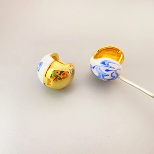 Blue and white porcelain enamel ball hoop earrings in high-polished gold finish