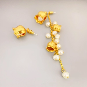 Asymmetric Lily of the Valley earrings with freshwater pearls and golden tassels