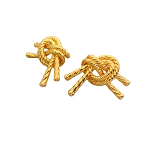 Vintage style gold knot stud earrings with twisted rope texture and polished finish