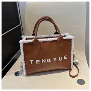 Brown vintage leather tote bag with white plush trim and TENGYUE brand text on crossbody