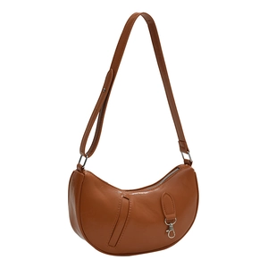 Fashionable brown crescent moon shoulder bag with polished patent leather and adjustable strap