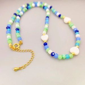 Colorful beaded necklace with heart charms, cultured pearls and golden adjustable chain