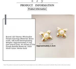 Detail view of flower earrings with white petals, pearls, and S925 silver needles