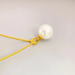Elegant white pearl pendant on a gold box chain necklace for minimalist daily styling