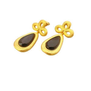 Vintage gold drop earrings with Chinese knot motif and black teardrop stones on white background