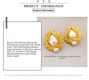 Detailed view of vintage wheat cicada earrings with large pearls and 18K gold finish