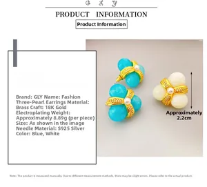 Macro detail of triple shell pearl stud earrings with 18k gold plating and S925 silver pins