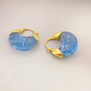 Chic blue resin hoop earrings with gold foil accents and polished metal links