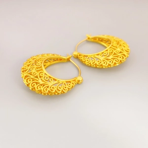 Elegant gold-tone hollow filigree hoop earrings with intricate vintage scroll patterns