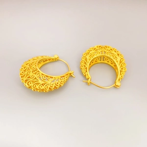 Elegant gold hollowed-out filigree hoop earrings with vintage crescent moon design
