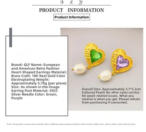 Detail of vintage heart earrings with 18K gold plating, emerald stones and drop pearls