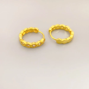 Elegant gold plated hoop earrings with micro pave crystals and wavy outer rim design