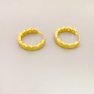 Elegant gold-plated geometric hoop earrings with textured wavy edges for a modern look