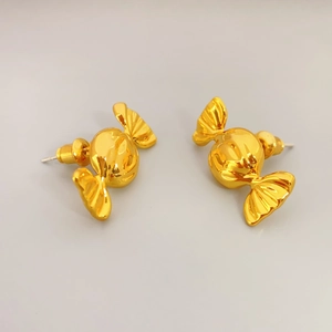 Polished gold candy shaped 925 silver needle stud earrings shown in a top-down view