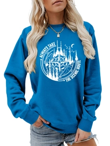 Close-up of circular mountain compass print on a navy blue crewneck sweatshirt