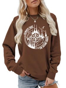 Detail of screen-printed forest and mountain graphic on a brown outdoor cotton sweatshirt