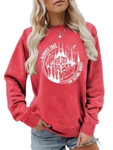 Detail of red crewneck sweatshirt with white compass and mountain graphic print