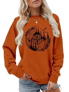 Detail view of the compass and mountain print on orange long sleeve scenic sweatshirt