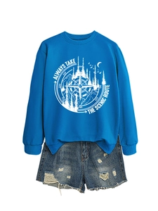 Close-up of royal blue sweatshirt with scenic route print and ripped denim shorts