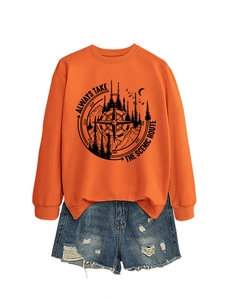 Detail of orange sweatshirt with scenic route print and distressed denim shorts