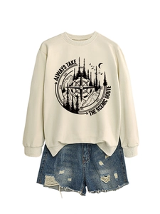 Detail of ivory sweatshirt with mountain print and distressed denim shorts on white background