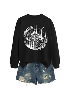 Close-up of the scenic route compass and mountain print on black sweatshirt fabric