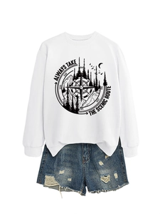 Detail of white sweatshirt with scenic route graphic and distressed denim shorts set