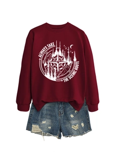 Detail of maroon crewneck sweatshirt with scenic route graphic and distressed denim shorts