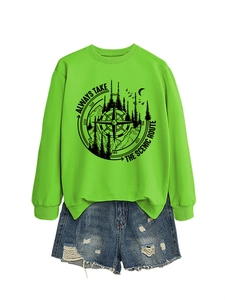 Detail of lime green sweatshirt with scenic route print and distressed denim shorts