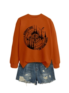 Detail of orange sweatshirt with scenic route compass print and ripped denim shorts