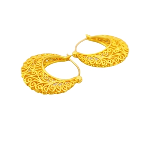 Elegant gold hollowed crescent earrings with intricate filigree texture on white background