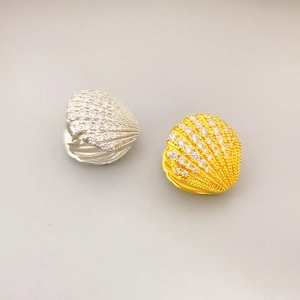 Elegant fan-shaped shell earrings with pave-set crystals in gold and silver plating