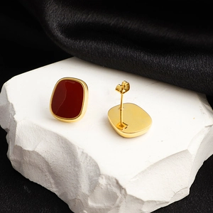 French vintage square burgundy stud earrings with gold plating on marble and silk