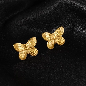 Elegant 18k gold plated stainless steel butterfly stud earrings on black silk