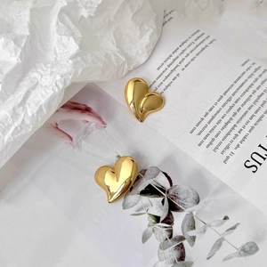 Chic gold heart stud earrings for women with a luxury polished finish and 3D design