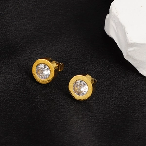 18K gold plated titanium roman numeral earrings with clear center zircon on black stone