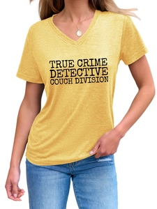 Detail of the True Crime Detective text print on a yellow V-neck short sleeve cotton t-shirt