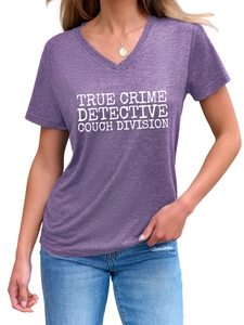 Detail of V-neck heather purple T-shirt with True Crime Detective slogan and soft fabric