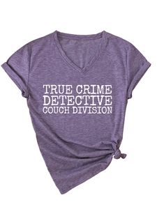Detail of V-neck purple T-shirt with rolled sleeves and a side knot hem styling